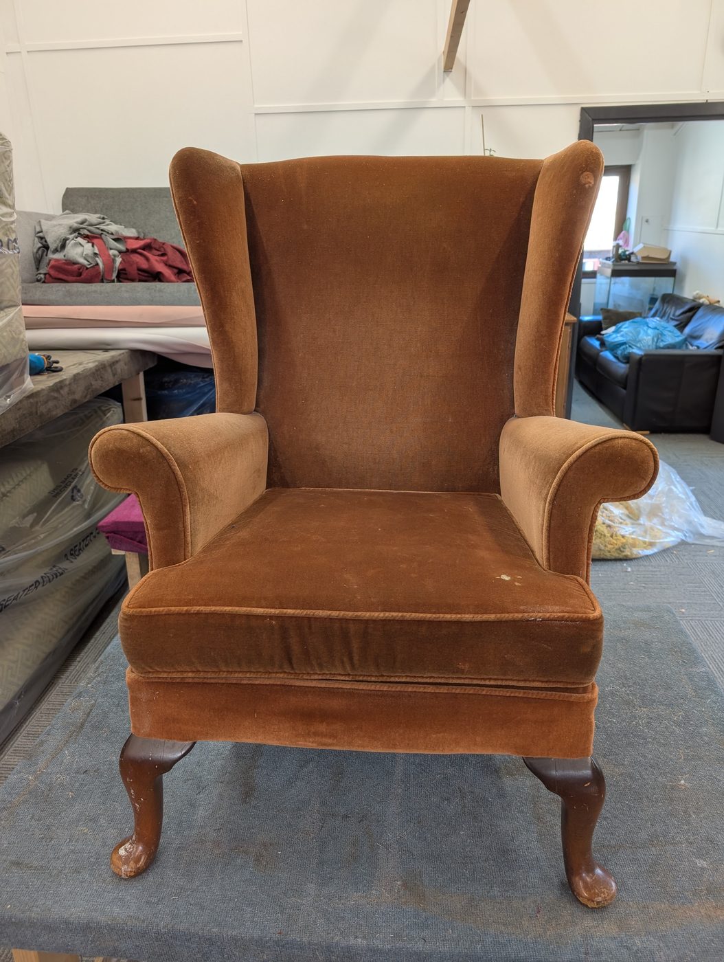 The Parker Knoll as it arrived — original brown mohair velvet, worn from years of use.