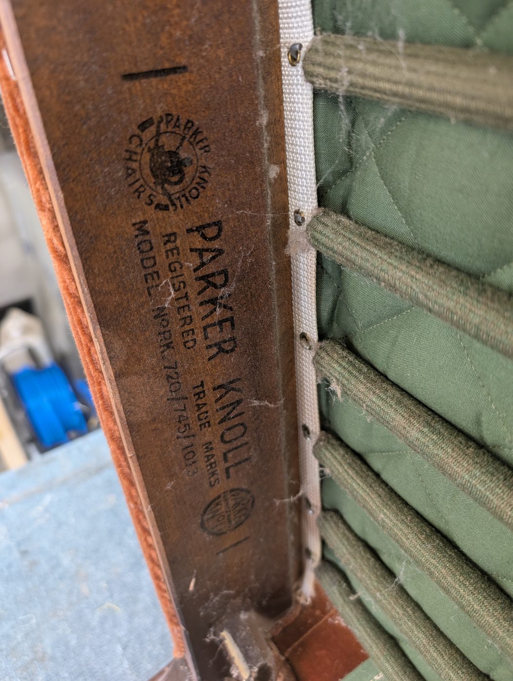 The registered Parker Knoll stamp — model PK 720/745/1013 — on the frame rail.