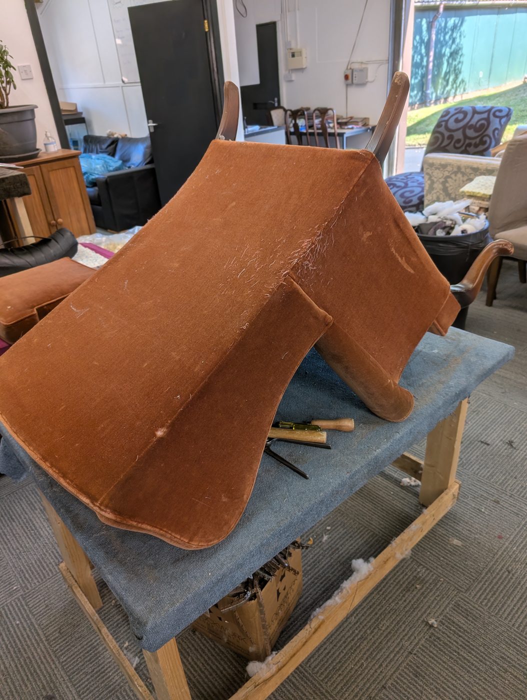 The old brown cover coming off with a staple unpicker, panel by panel.