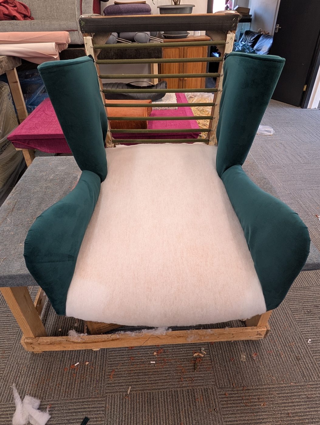 The inside back going on — pulled taut up the centre and into the wings.
