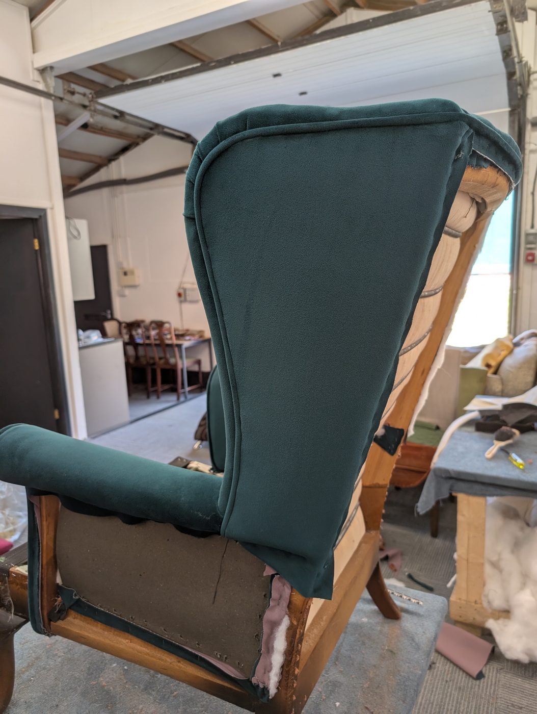 A finished outside wing — piped, taut, and closed in cleanly.