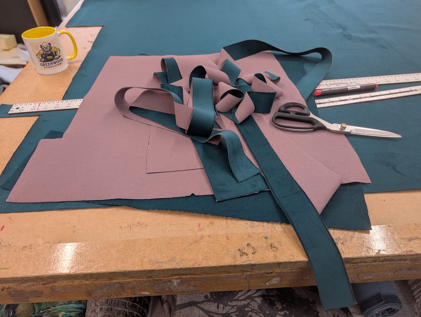 The seat cushion panels cut from the teal velvet, pile matched, ready to sew.