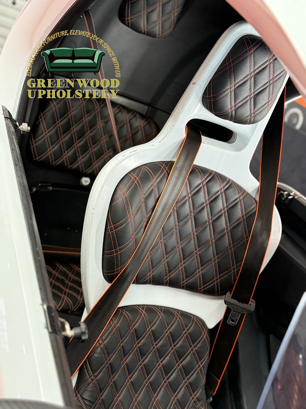 The detail — double-diamond rows lining through from headrest to seat base.